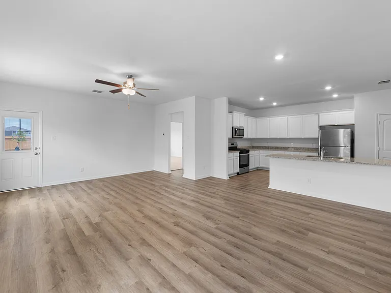 Main living area with vinyl flooring.