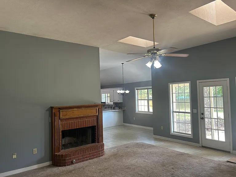 Carpet replaced by flooring. Tile and flooring throughout house.