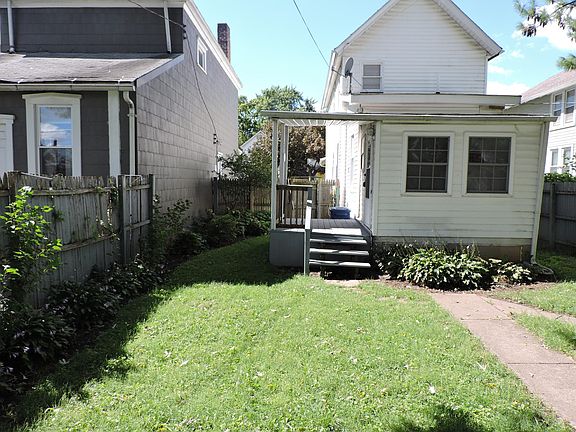 Back yard view from alley parking pad.