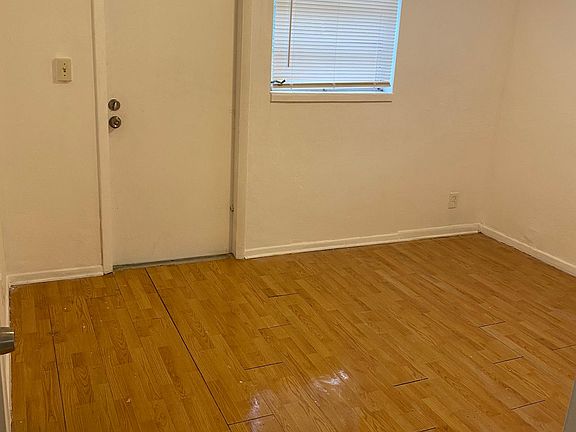 Bedroom with back door leading to back yard