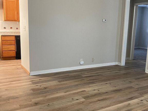 Living room with updated flooring.