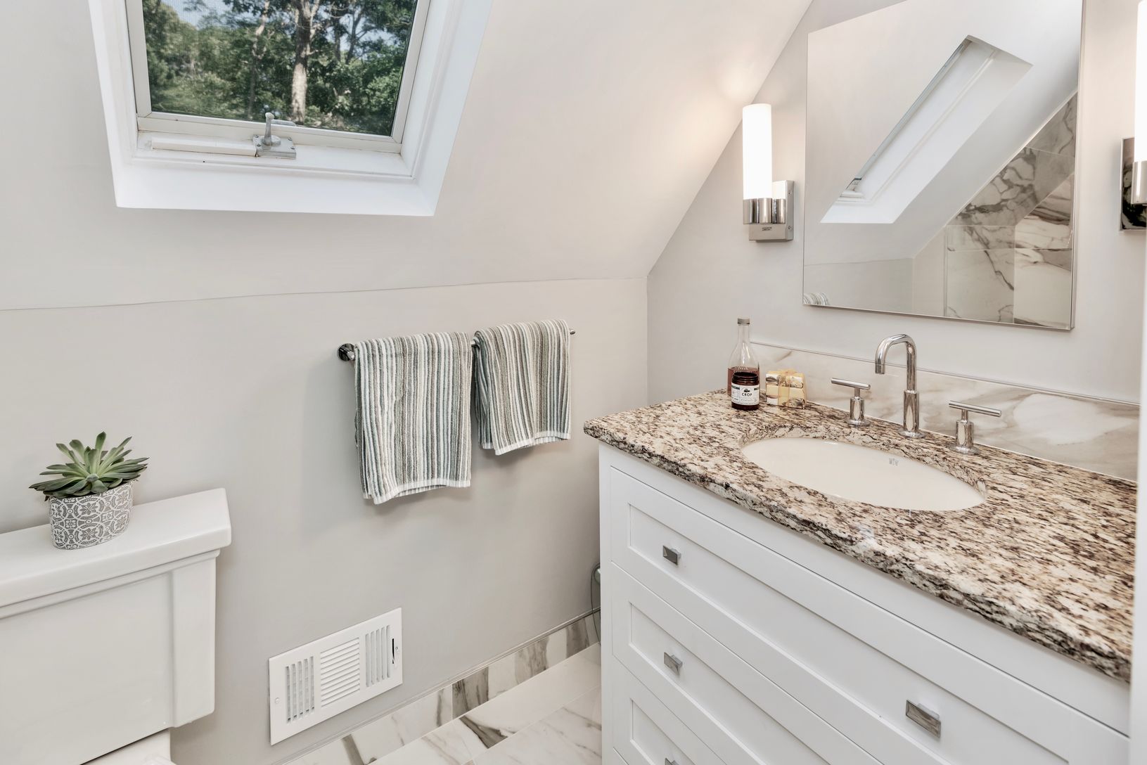  Three skylights add to the charm or the updated fixtures.