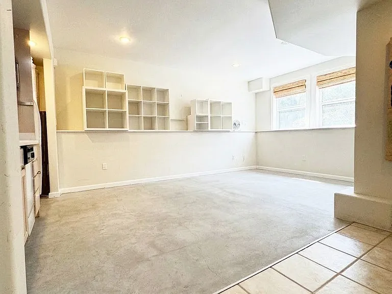 Garden level second master suite with private entry, kitchenette and full bathroom. Can be used as office, guest bedroom, yoga studio, etc.