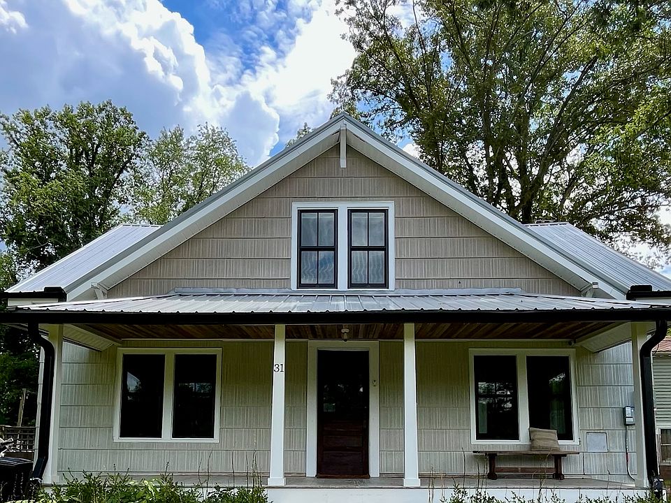 Curb Appeal with Cottage Charm
Quaint and welcoming front facade with gravel path, perennial landscaping, and fresh exterior paint. A true Arts & Crafts gem.