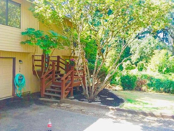 Home Located On Dead End Street Bordering Trees