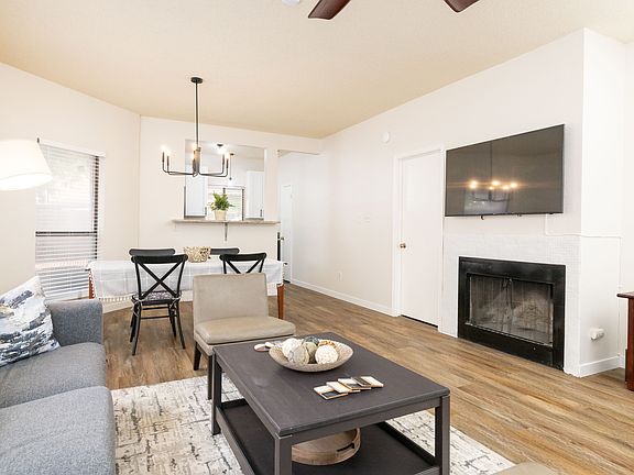 View from the living room into the dining area and kitchen