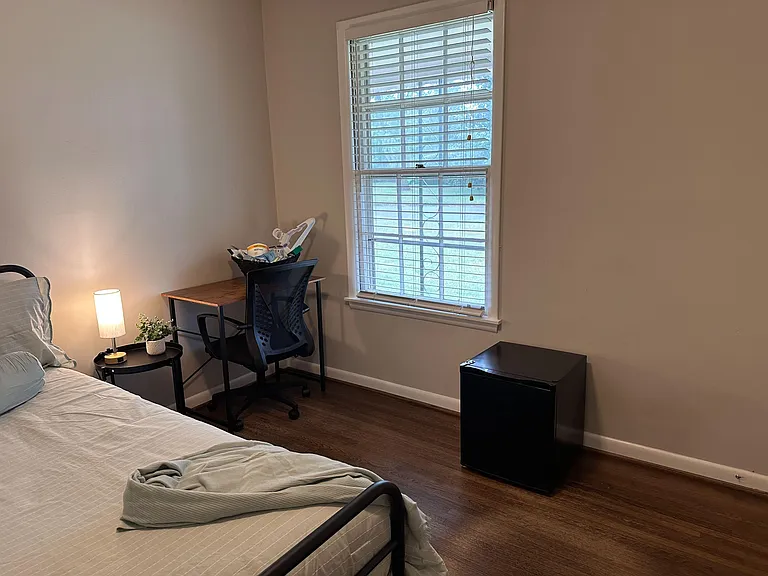 Yup! We've got a desk with an ergonomic chair and a refrigerator to keep your favorite drinks cool.