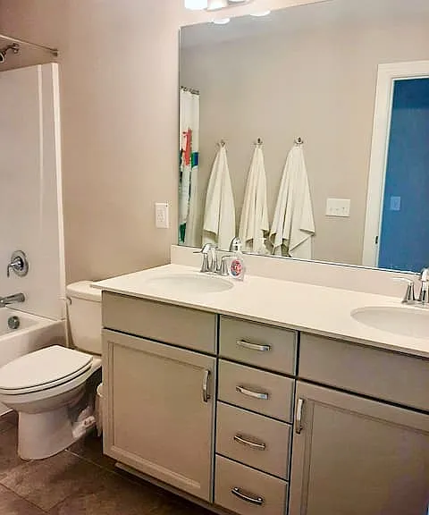 2nd story full bath with 2 sinks and tub/shower combo.