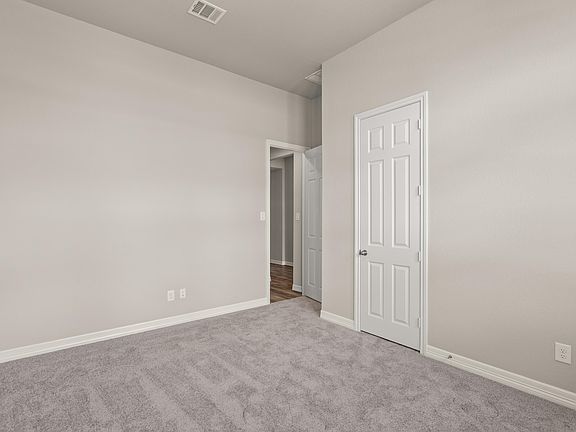 An additional view of the secondary bedroom with a large closet.