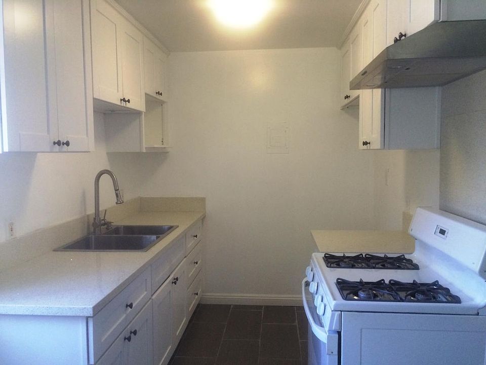 Updated kitchen cabinets with quartz counter top