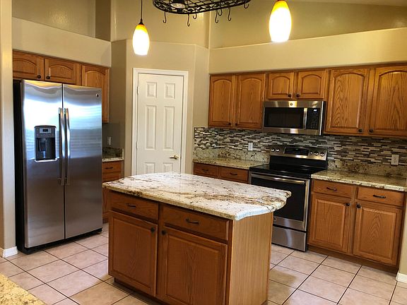 spacious pantry, island and lots of storage cupboards in kitchen