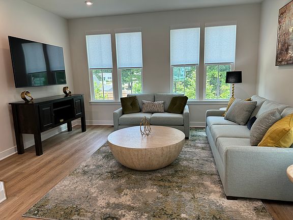 Spacious Living Room to entertain your guest with new modern furniture and 60 inch smart tv.