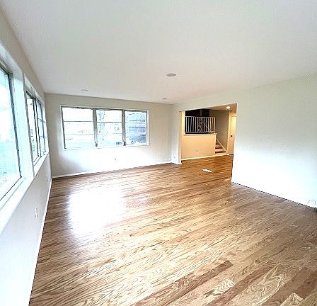 More of large sunny family room. Door to patio