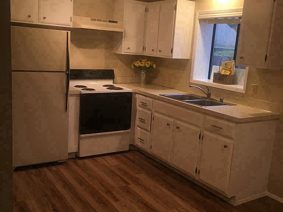 Kitchen with vinyl plank flooring.