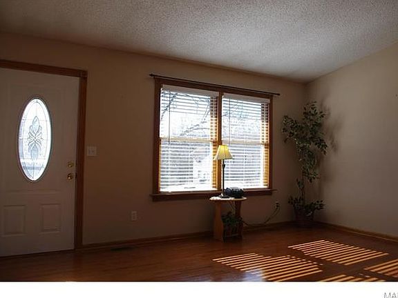 Beautiful hardwood floors and pella windows in this spacious living room