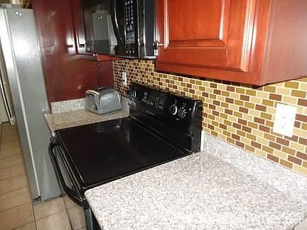 Great Kitchen
						:
						Granite Counters and Custom Cherry Cabinets