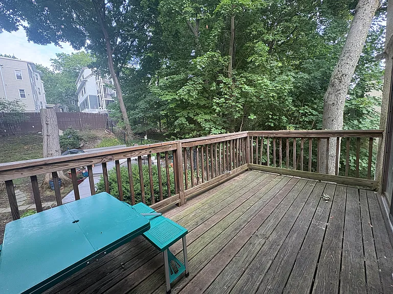 Large private deck overlooking owner's back yard. Lots of green space. Deck large enough to put outdoor sofas or dinning room table.