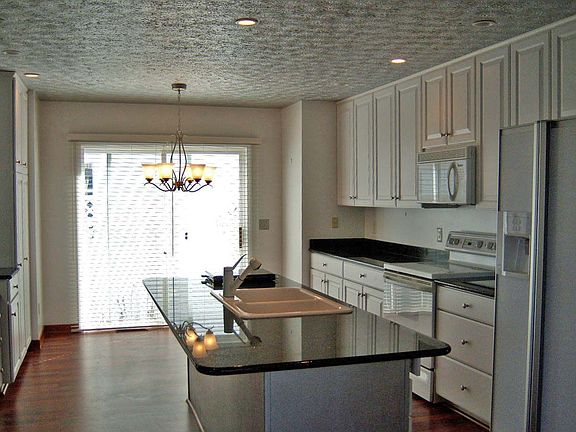 Plenty of Cabinets, Granite Counters and Island, All Appliances Stay.