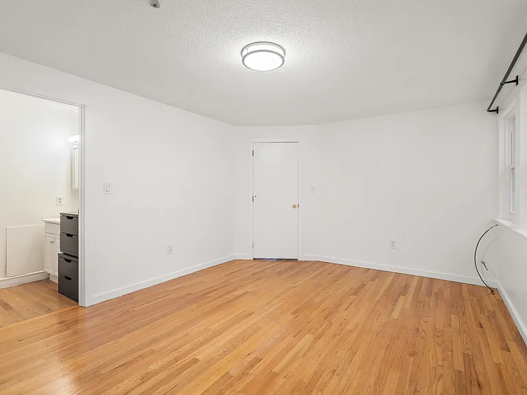 Primary Bedroom with walk-in closet and sink