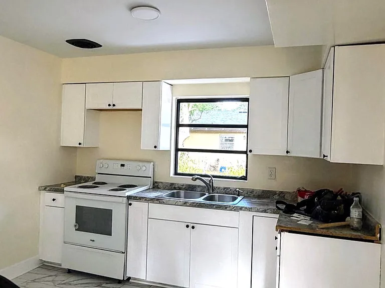 Newly renovated kitchen, cabinets, and flooring.