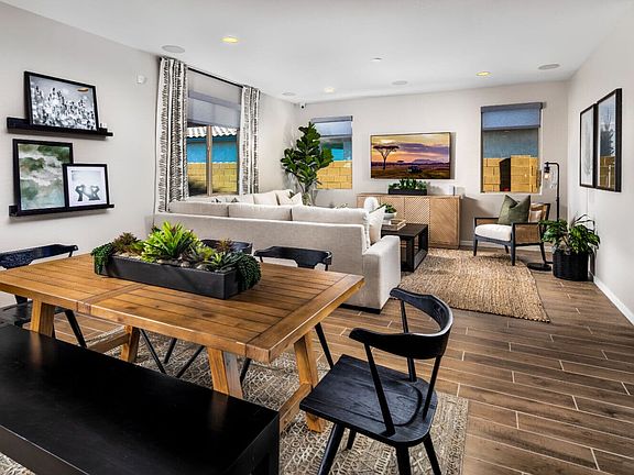 Dining and living spaces within the great room of the Dakota model home.