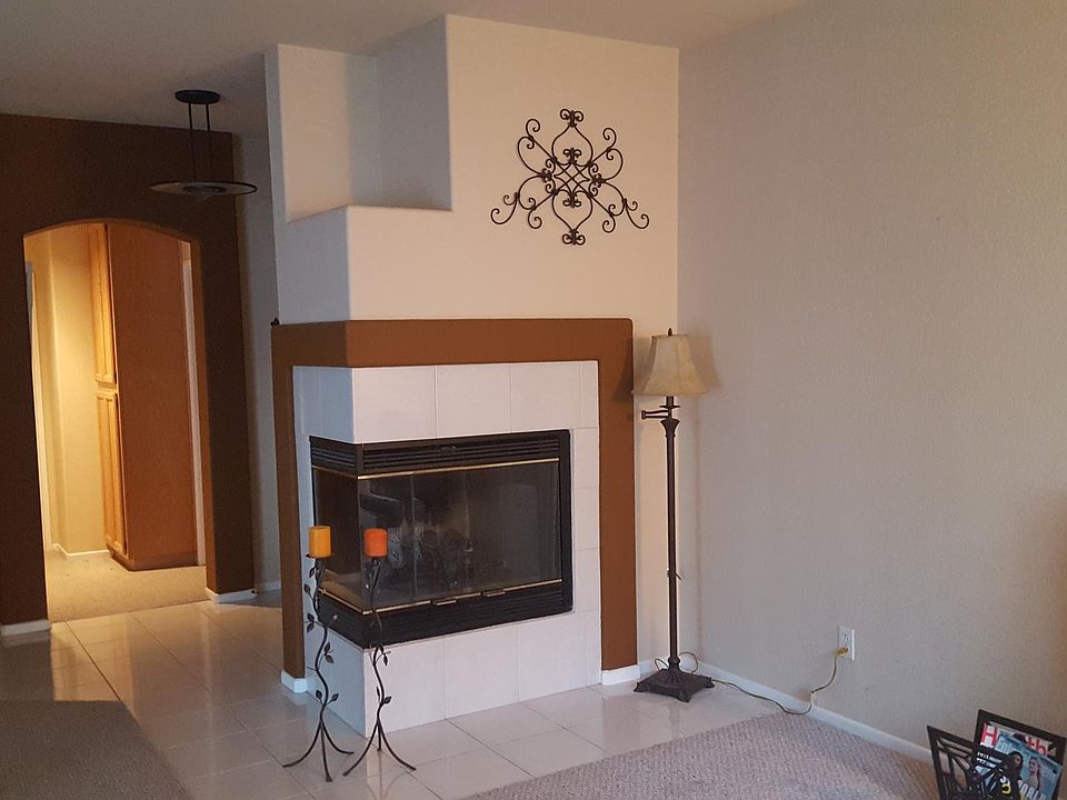 Living room with corner fire place