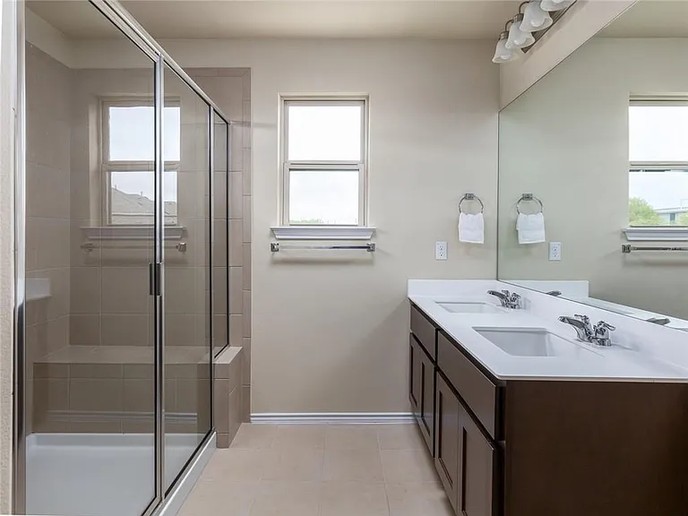 Walk in shower with seat and double vanity