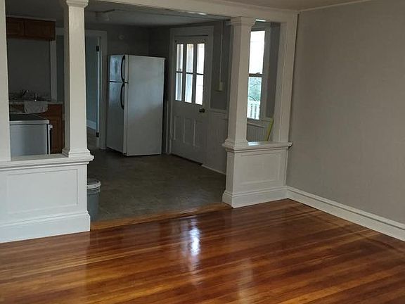 different view of living room into kitchen
