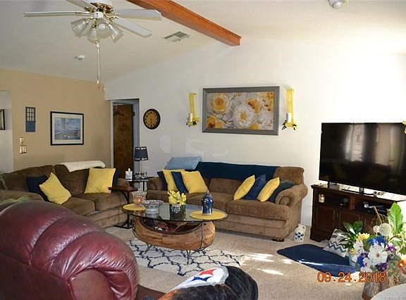 Large living area with vaulted ceiling. New carpet installed in 2015.