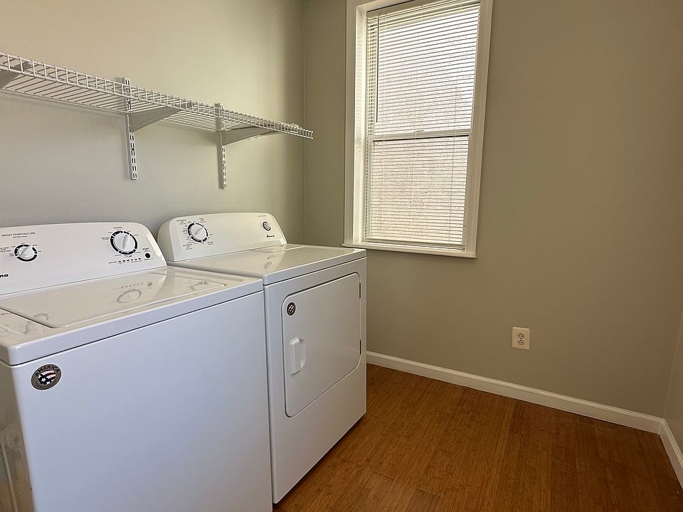 In unit large laundry room with storage