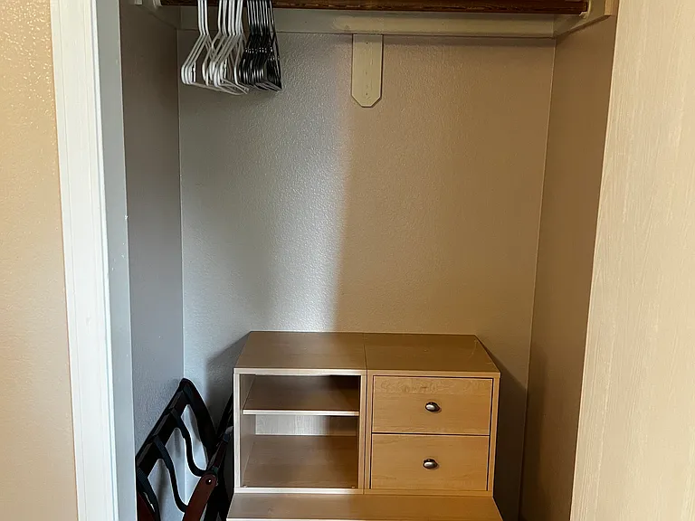 upstairs closet in primary bedroom