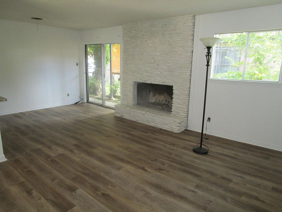 Den with large fireplace