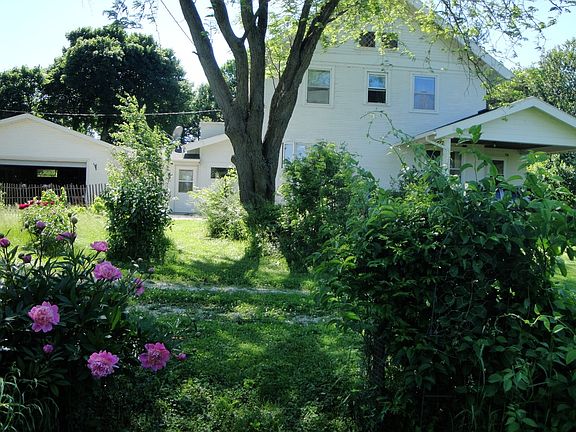 View from east.  Driveways.