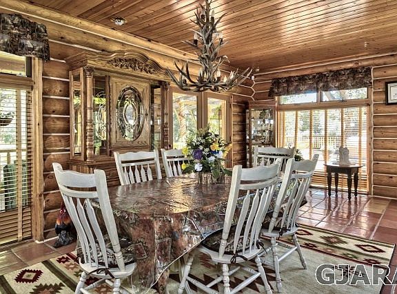 formal dining room with antler chandelier