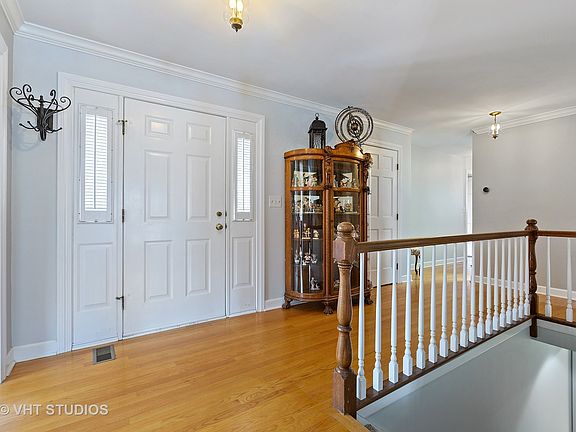 Large foyer has Beautiful Gleaming Harwood floors
