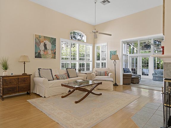 Living room with fireplace adjacent to family room