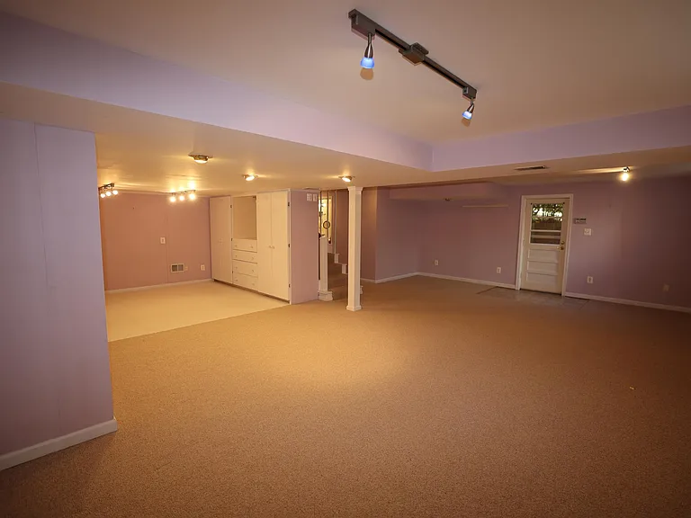 Very spacious multi-functional finished lower level with door to backyard.