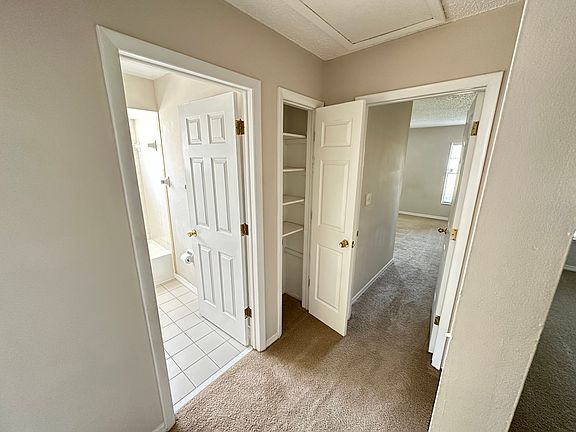 Hallway. Bathroom to left and straight ahead is the master bedroom with in suite bathroom.