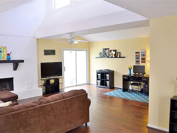 Greeted with soaring ceilings and an open and inviting floor plan after you enter from the courtyard