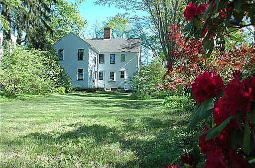 large yard with stone walls