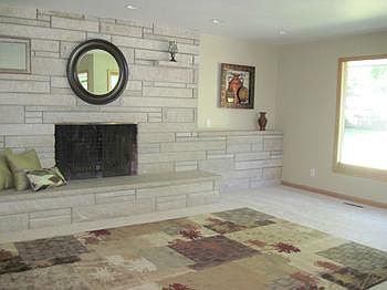 Warm up with this brick raised hearth fireplace 
