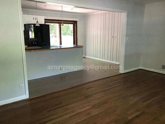 Den opening into kitchen
