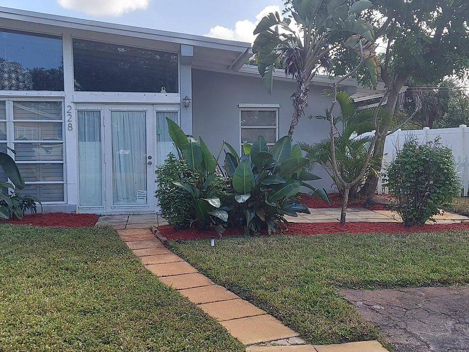 Front door, patio and 2 parking spaces
