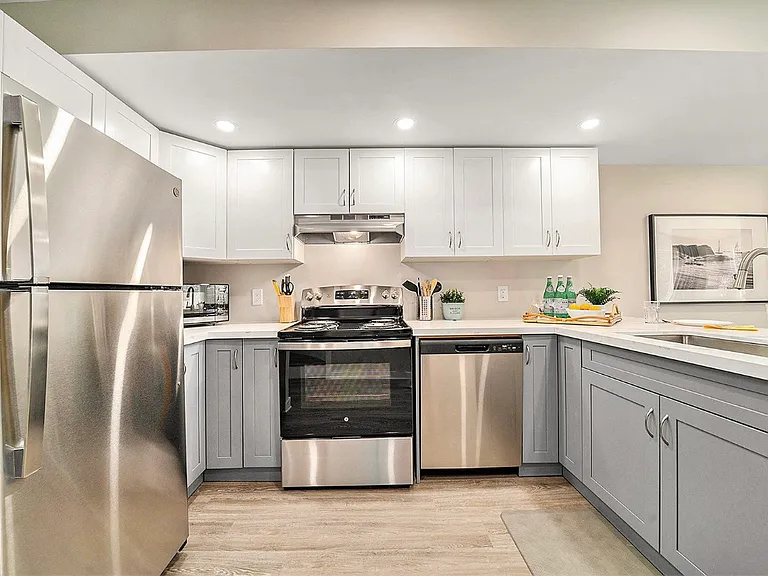 Modern open-concept kitchen in an Ottawa professional rental.