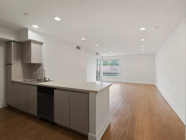 Open-Concept Floor Plan with Recessed Lighting, Vinyl Flooring, and Patio