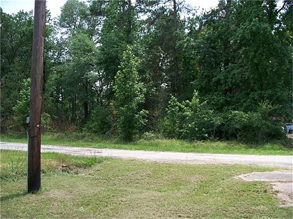 WOODED LOT ACROSS THE STREET