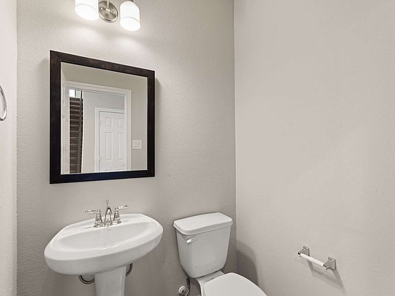 The powder room is conveniently located close to the main living space.