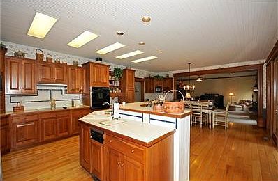 Cedar Sunroom opens to kitchen.  A delightful area for entertaining or for reading and relaxing.