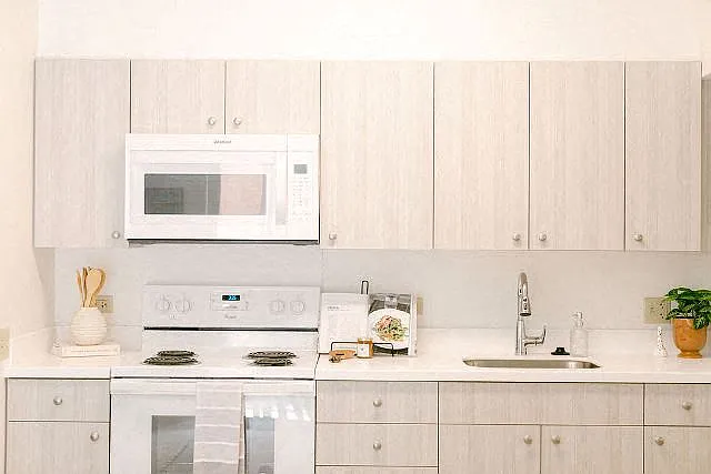 Kanekapolei Collection Kitchen area with appliances and cabinets