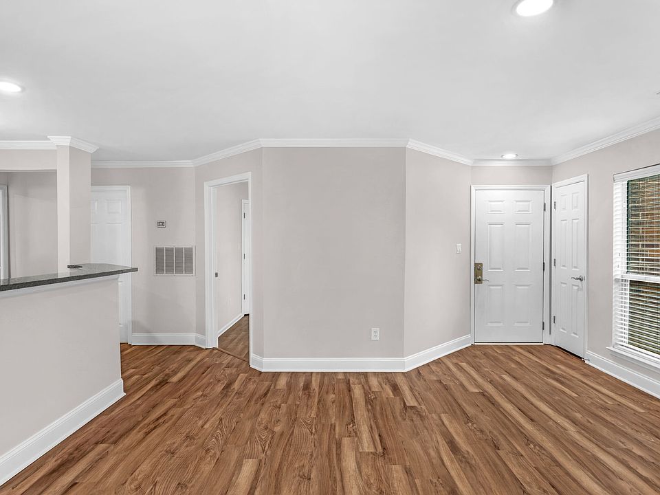 Main Living Area. View of Front Entrance and Secondary Bedroom Entrance.
